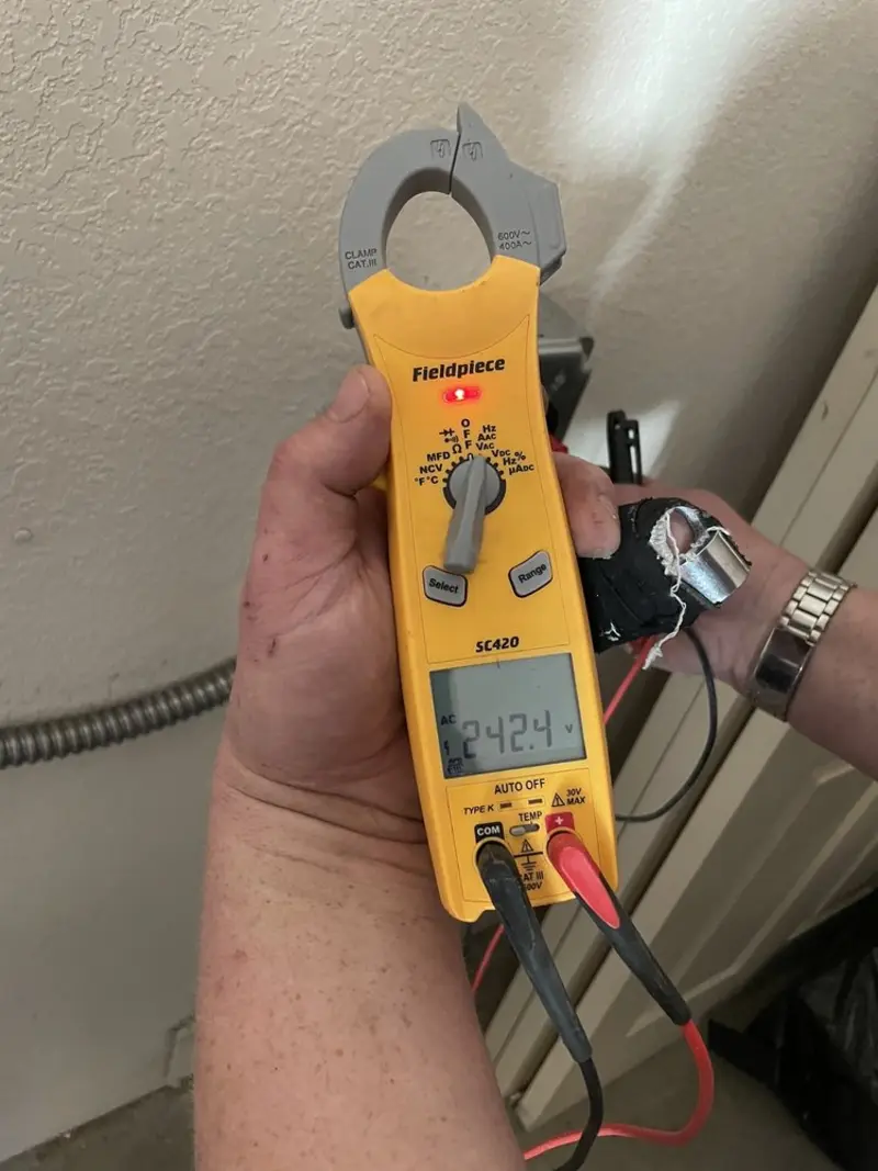 Voltage testing with clamp meter during Ceiling Fan Installation in Concord